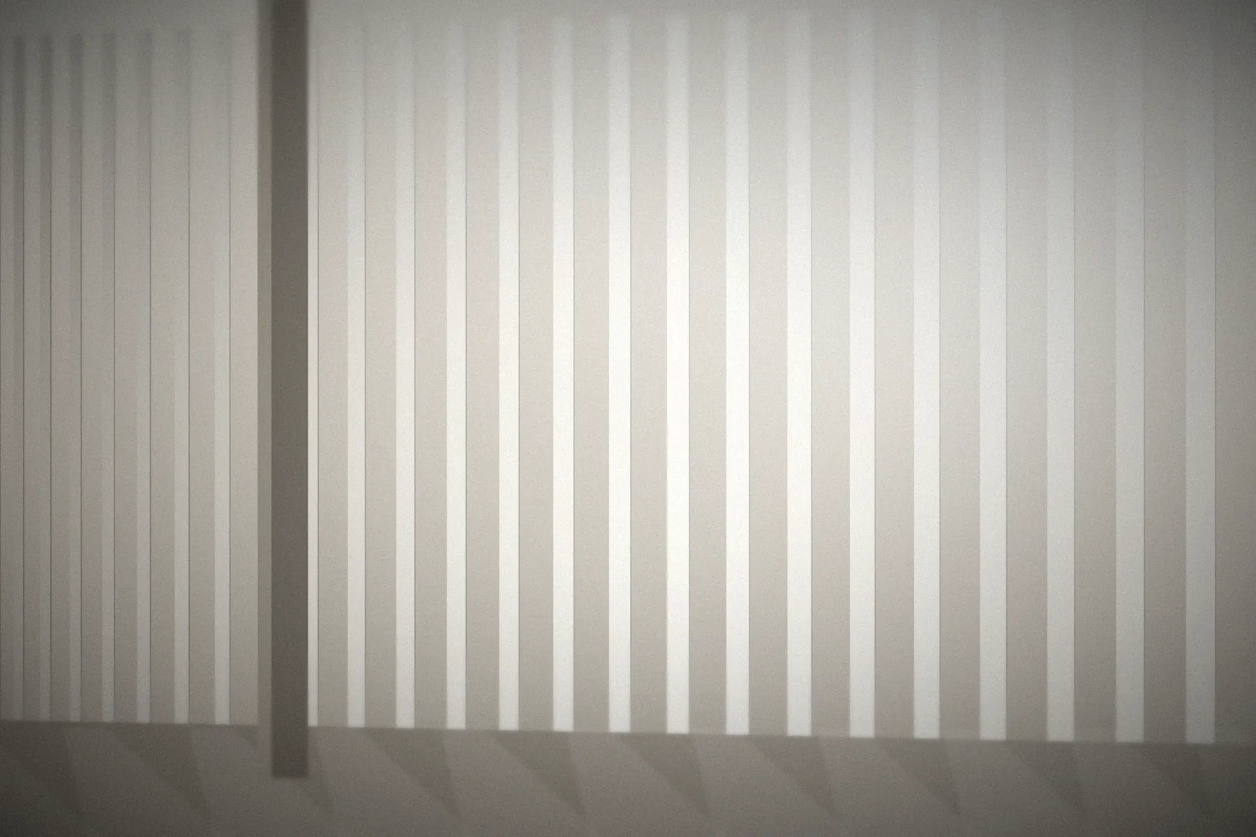 Daylight falling across the vertical louvres of a quiet modern studio interior.